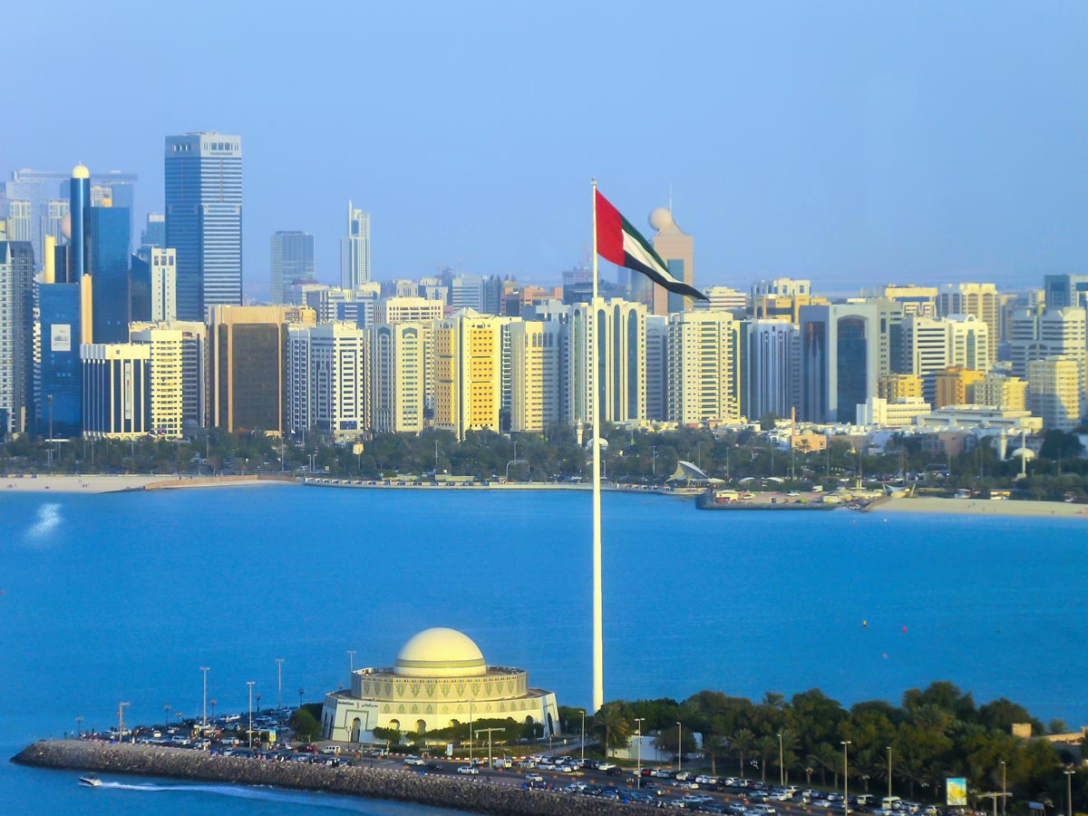 New UAE Unemployment Scheme: Abu Dhabi with UAE flag