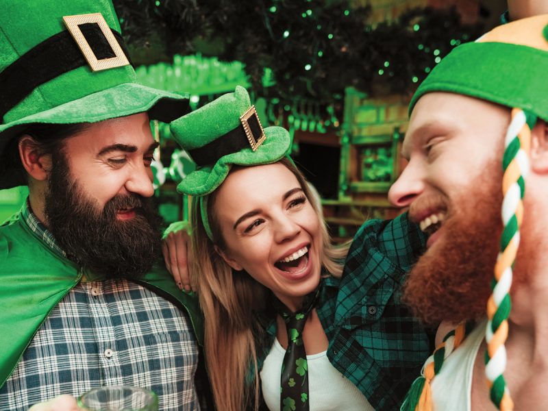 St. Patrick's Day in Abu Dhabi: people wearing green shamrock hats and smiling