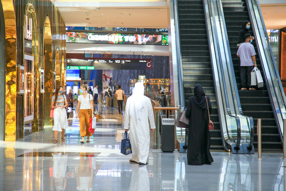 man and woman walking through the mall during Dubai Summer Surprises