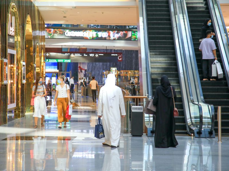 man and woman walking through the mall during Dubai Summer Surprises