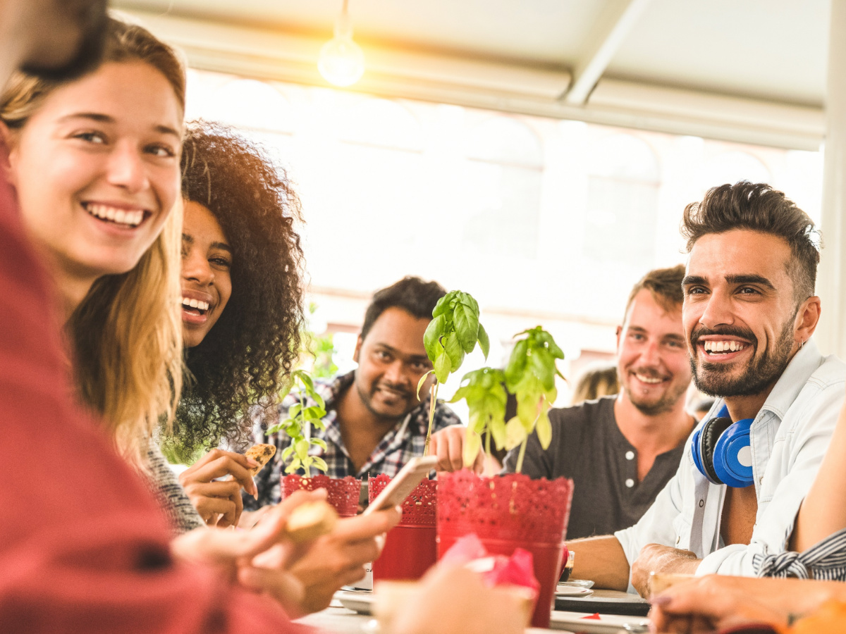 UAE COVID update: People smiling at table at an outdoor restaurant