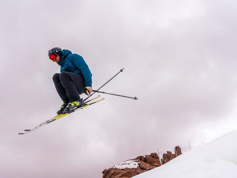 Trojena by Neom: Man doing ski jump on snowy mountain