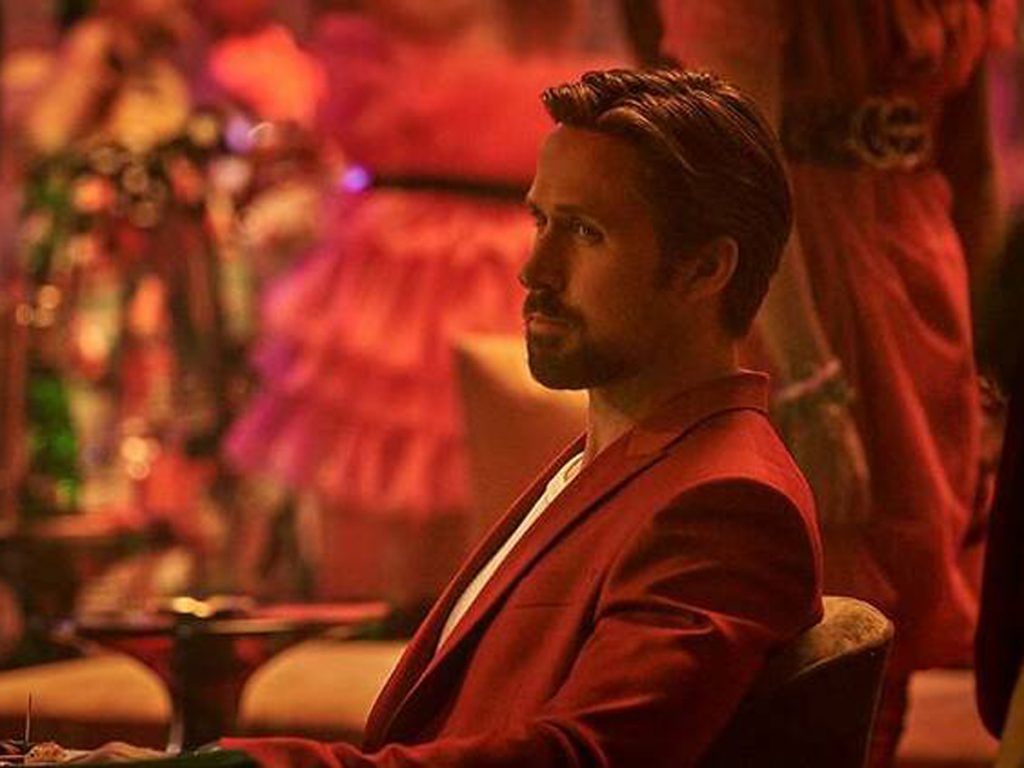 The Gray Man with Ryan Gosling seated at a table: new movies to see in UAE cinemas this weekend